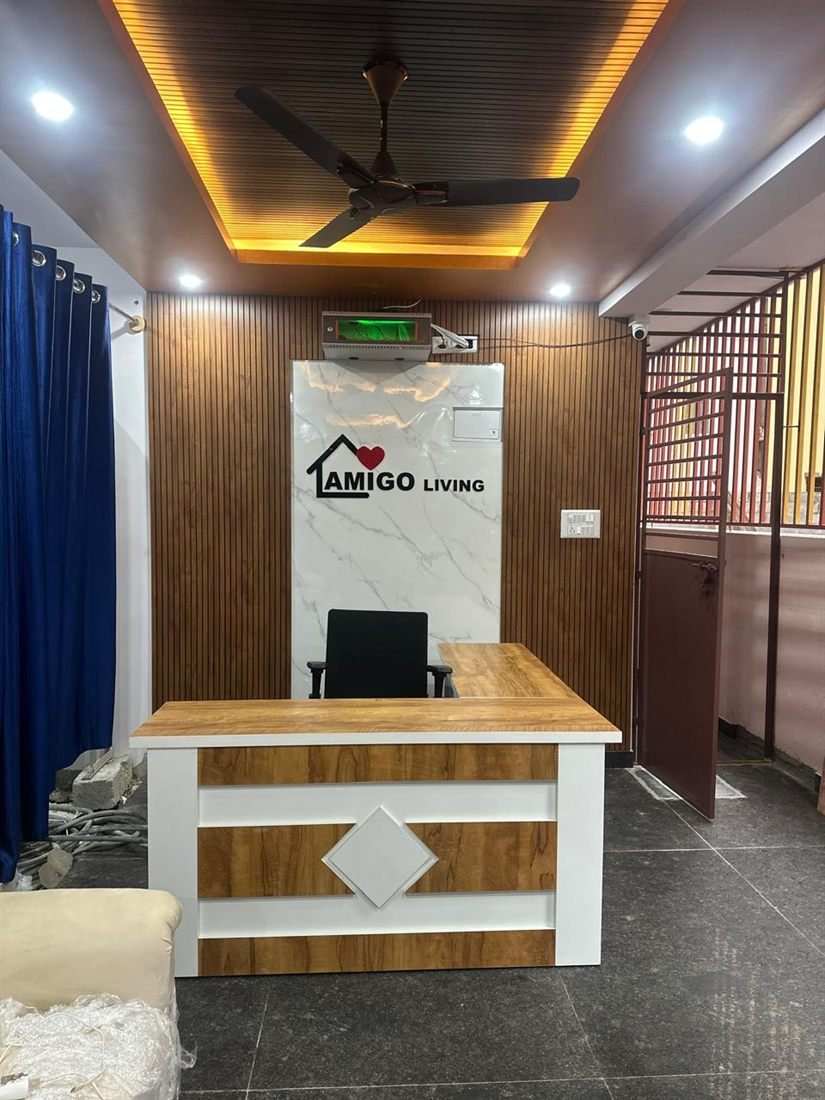 AMIGO Living reception lounge with wood panelling and gold ceiling lighting