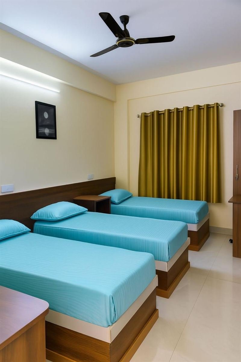 Triple room with turquoise bedding and side tables